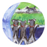Three schnauzers in window stickers