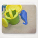 Toys on the beach mousepads