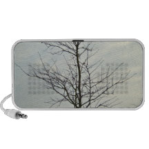 Tree without leaves against the blue sky speakers