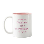 Trust Me. I'm A Prefessional. (Pink) mugs