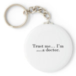 "Trust me... I'm (almost) a doctor." keychains
