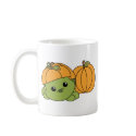 Turtle Cutie in a Pumpkin Suit! mugs