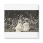 TWO ADORABLE CHILDREN SITTING BY BASKETS magnets