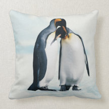 Two affectionate penguins throw pillows
