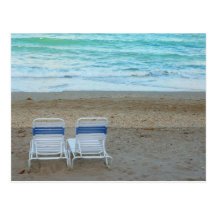 Two chairs on beach sand ocean waves postcards