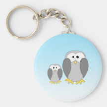 Two Cute Penguins. Cartoon on Sky Blue. Keychains