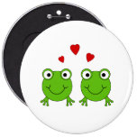 Two green frogs with red hearts. buttons
