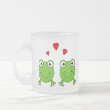 Two green frogs with red hearts. coffee mugs