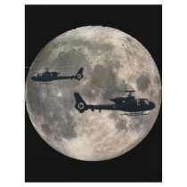two helicopters silhouetted by a full moon