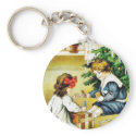 Two kids playing infront of the christmas tree keychains