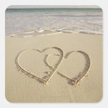 Two overlying hearts drawn on the beach square stickers