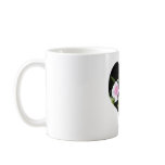 Two pink roses within a heart mug