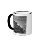 USA. Molten lava flows into the ocean at sunrise Mugs