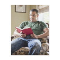 USA, Utah, Young man reading book Post Cards