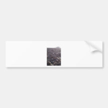 View over pebbles to silouetted West Pier Bumper Sticker