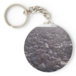 View over pebbles to silouetted West Pier keychains