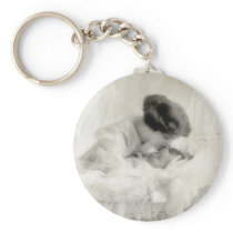 Vintage Mother Kissing Baby in Bassinet
