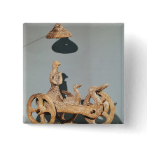 Votive chariot with an anthropomorphic divinity pins