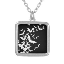 White Bats on Black Necklaces
