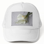 white calla lilies on decorative cloth hat