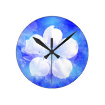White flower on a blue background round wallclocks