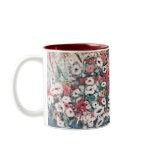 White mug with red has floral painting in blue red