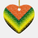 White pumpkin pattern on orange black green yellow ornament