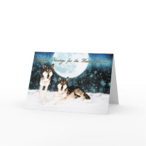 winter solstice greeting card with wolfs and moon