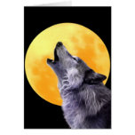Wolf howls at the full moon greeting card