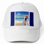 woman laying on the beach hats