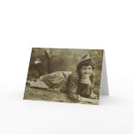 Woman laying on the grass greeting card