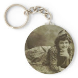 Woman laying on the grass keychains
