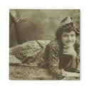 Woman laying on the grass magnets