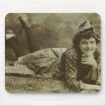 Woman laying on the grass mousepads
