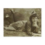 Woman laying on the grass post cards
