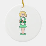 Woman with a hot soup pot. In green and white. ornaments