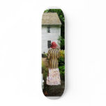 Woman With Striped Jacket and Flowered Skirt skateboards