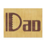 Wooden Dad Word on Wood Background Post Card