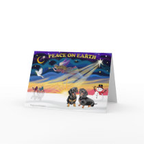 XmasSunrise-2 black Dachshunds Greeting Card