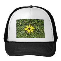 Yellow flower in the grass trucker hats
