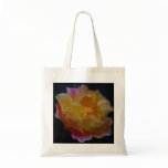 Yellow rose with pink and meaning bags
