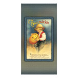 Young boy is carving a jack o' lantern photo card template