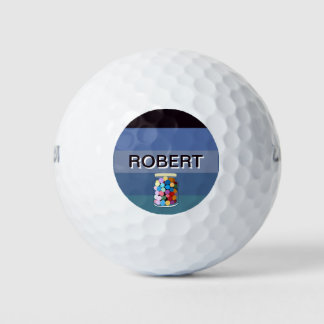 Сolorful candies in a glass jar golf balls