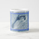 Search for footprints in the sand mugs Ocean