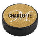 Search for gold hockey pucks Sports