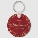 Search for gold and red key rings For her