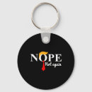 Search for nope key rings Political