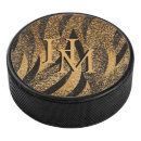 Search for gold hockey pucks Sporty