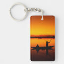 Search for boat at sunset key rings Ocean