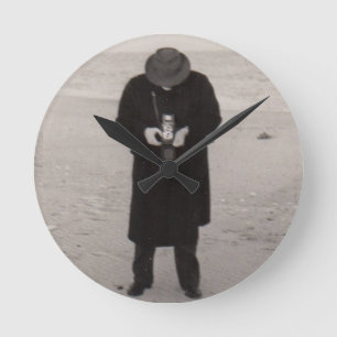 1940s photographer on the beach round clock
